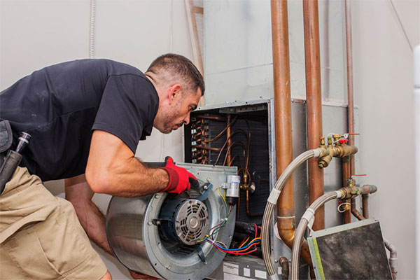 How does an air handler differ from an air conditioner?